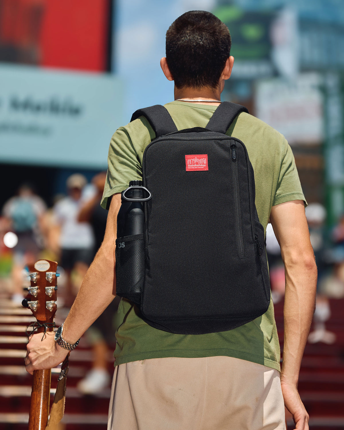 Male Model wears Linden Hill Backpack on the back 