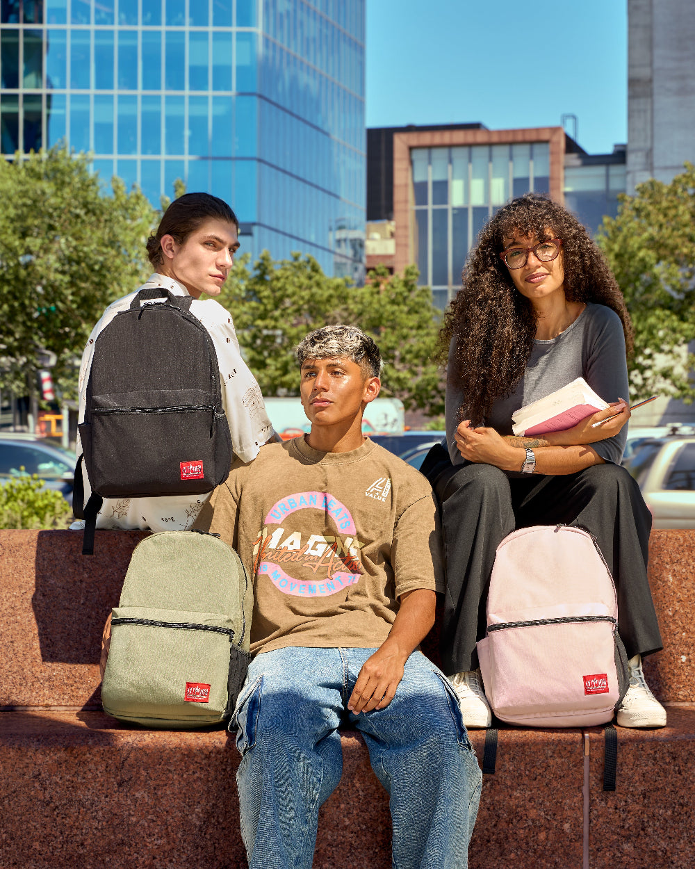 Three models with Manhattan Portage Daffodil Backpack Blossom